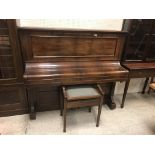 A circa 1900 rosewood cased upright piano, the iro