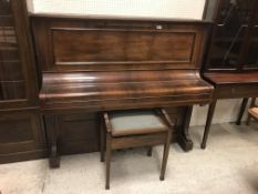 A circa 1900 rosewood cased upright piano, the iro