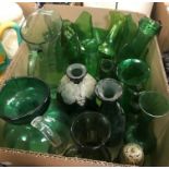 A collection of assorted green glass jugs, vases etc