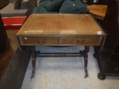 A reproduction mahogany drop-leaf sofa table in th