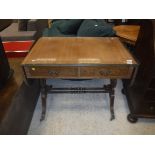 A reproduction mahogany drop-leaf sofa table in th