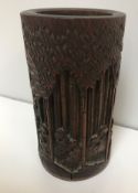 A 19th Century Chinese carved bamboo brush pot with seven sage design 12.5 cm high