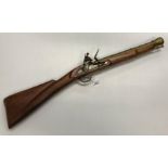 A reproduction Continental sporting flintlock muzzle loading carbine or blunderbuss black powder