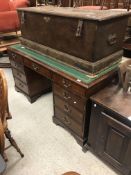 A modern mahogany double pedestal desk in the Geor