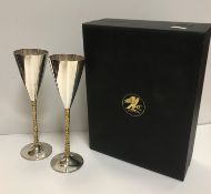 A pair of Stuart Devlin silver and gilt goblets of conical form bearing Senior Falcon crest to