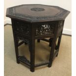 An Indian carved rosewood octagonal occasional table (67 cm diameter x 60 cm H)Condition