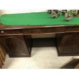 A Victorian mahogany sideboard, the plain top with