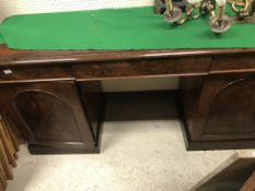 A Victorian mahogany sideboard, the plain top with