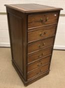 A mahogany glazed hanging corner cabinet, 77 cm wide x 95.5 cm high, a modern oak filing cabinet