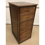 A mahogany glazed hanging corner cabinet, 77 cm wide x 95.5 cm high, a modern oak filing cabinet