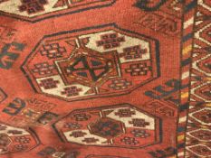 A Bokhara rug, the central panel set with repeatin