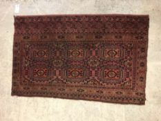 A Bokhara Salour rug, the main panel set with two
