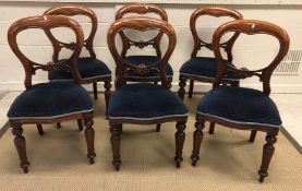 A set of six 20th Century mahogany dining chairs in the Victorian manner with upholstered seats on