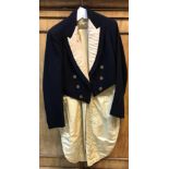A vintage blue and silk tailed hunt coat with engraved Beaufort Hunt brass buttons.