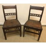 A pair of 19th Century oak bar back panel seat chairs on square tapered legs united by stretchers