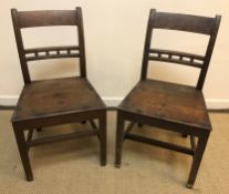 A pair of 19th Century oak bar back panel seat chairs on square tapered legs united by stretchers