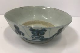 A Chinese export bowl with blue and white decoration 16.5 cm in diameter