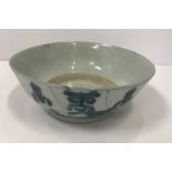 A Chinese export bowl with blue and white decoration 16.5 cm in diameter