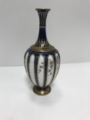 A Royal Worcester blue and gilt decorated stem vas