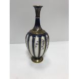 A Royal Worcester blue and gilt decorated stem vas