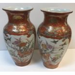 A pair of 19th Century Chinese Kutani ware vases decorated with panels of birds, blossom and figures