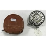 A Hardy "The L.R.H. Lightweight" 3 1/8" diameter fly reel, together with maker's leather pouch