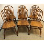 A set of six modern oak wheel and stick-back dining chairs