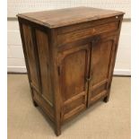 A 19th Century Indian teak cupboard, the plain top above a parquetry inlaid frieze and two