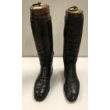 Two pairs of gentlemen's black leather hunting boots with trees