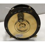 A 41/4" Perth style salmon fly reel with wooden rim and backplate