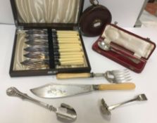 A collection of items to include a Constantia leather cased tape measure, a cased silver trefid