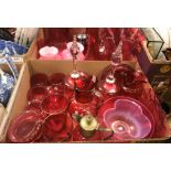 A collection of assorted cranberry glass to include Mary Gregory style decorated jug and two