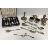 A collection of silver wares including a cased set of six silver teaspoons (by James Dixon & Son,