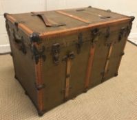 A circa 1900 Drucker trunk, painted canvas covered with studded leather and metal embellishments and