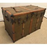 A circa 1900 Drucker trunk, painted canvas covered with studded leather and metal embellishments and