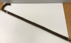 A circa 1900 walking stick hand measure with level and measurements in hands and metresCondition