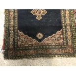 A Shenna rug, the central panel set with three med