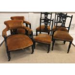 A Victorian ebonised salon suite of two tub chairs and four standard chairs