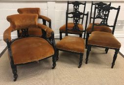 A Victorian ebonised salon suite of two tub chairs and four standard chairs