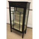An Edwardian mahogany and satinwood strung single door display cabinet with painted decorated