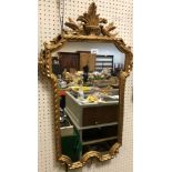 Two modern gilt framed mirrors, one of oval form with floral decoration, 56 cm x 46.5 cm, the