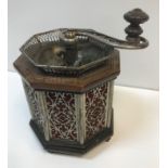 An unusual early 20th Century coffee grinder of octagonal form with mahogany and inlaid top and base