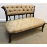 A Victorian canape (settee) with gold self patterned floral upholstery, 104 cm wide x 83 cm deep x