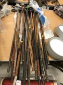 A collection of twenty-five various hickory shafted and other golf clubs, mainly putters,