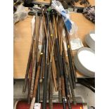 A collection of twenty-five various hickory shafted and other golf clubs, mainly putters,