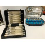 A mahogany cased mother of pearl handled twelve place fish knife and fork set, an onyx chess set,