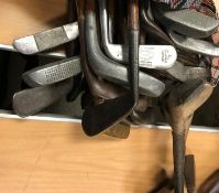 A collection of thirty various hickory and other shafted clubs including a "St. Andrews Putter", "