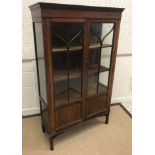 An Edwardian mahogany and satinwood strung two door display cabinet, 90.5 cm wide x 34 cm deep x