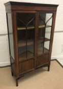 An Edwardian mahogany and satinwood strung two door display cabinet, 90.5 cm wide x 34 cm deep x