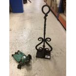 A wrought iron door porter 40.5 cm high together with a Victorian wrought iron boot jack (jack
